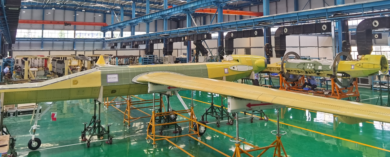 Unmanned aerial vehicle (UAV) undergoing assembly in a modern aerospace manufacturing facility